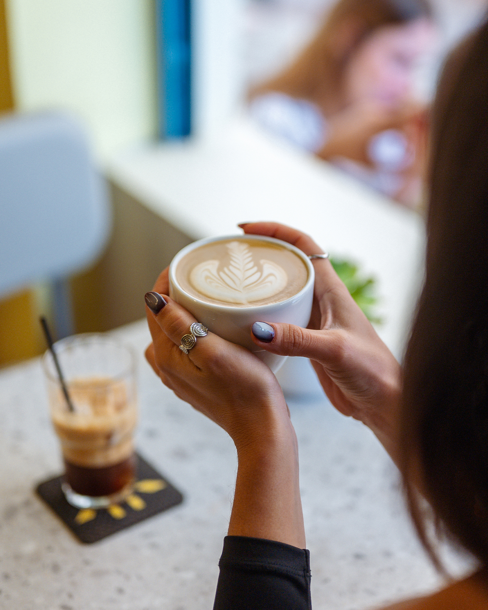 A close-up of a Tziraf coffee cup