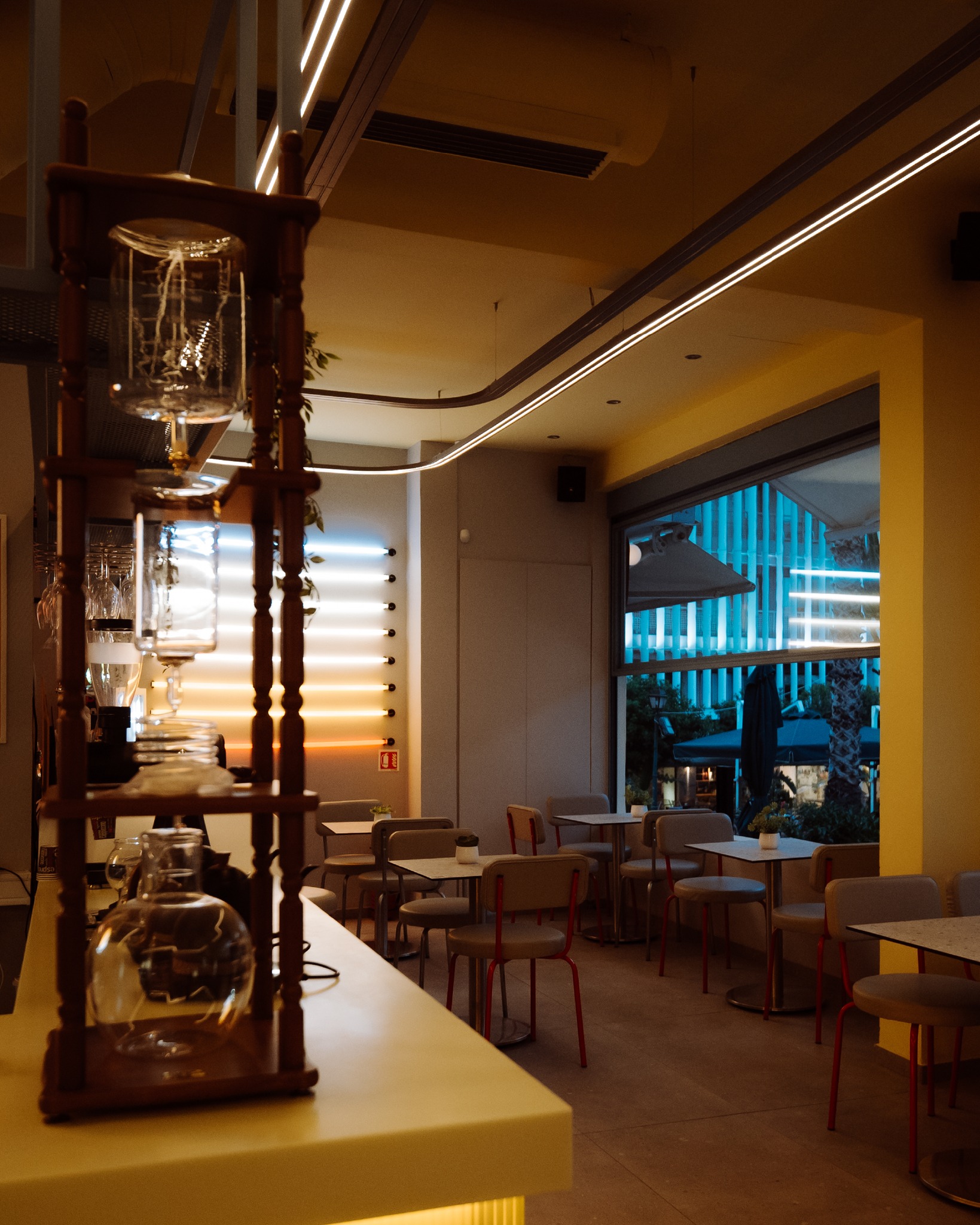 Tziraf interior bathed in warm yellow light